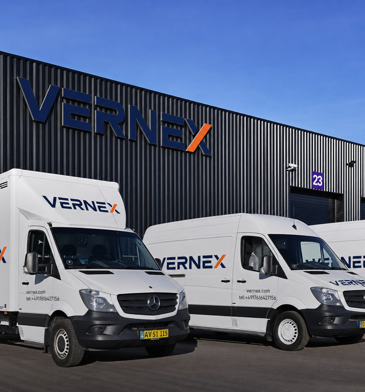 Vernex delivery vehicles parked outside a Vernex logistics facility